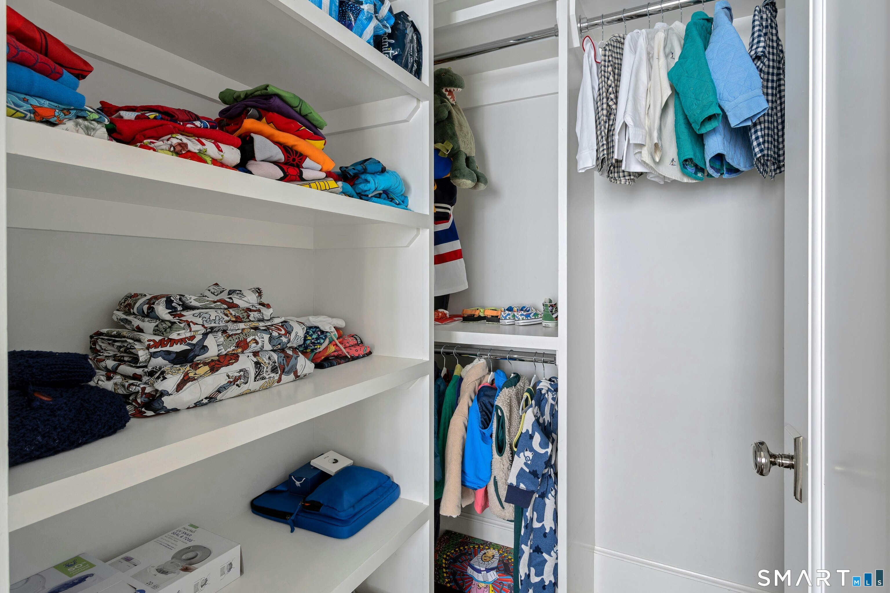 45 Jelliff Mill Road, Unit 45 New Canaan, CT 06840 - Photo 26 of 36 a utility room with lots of clutter and toys