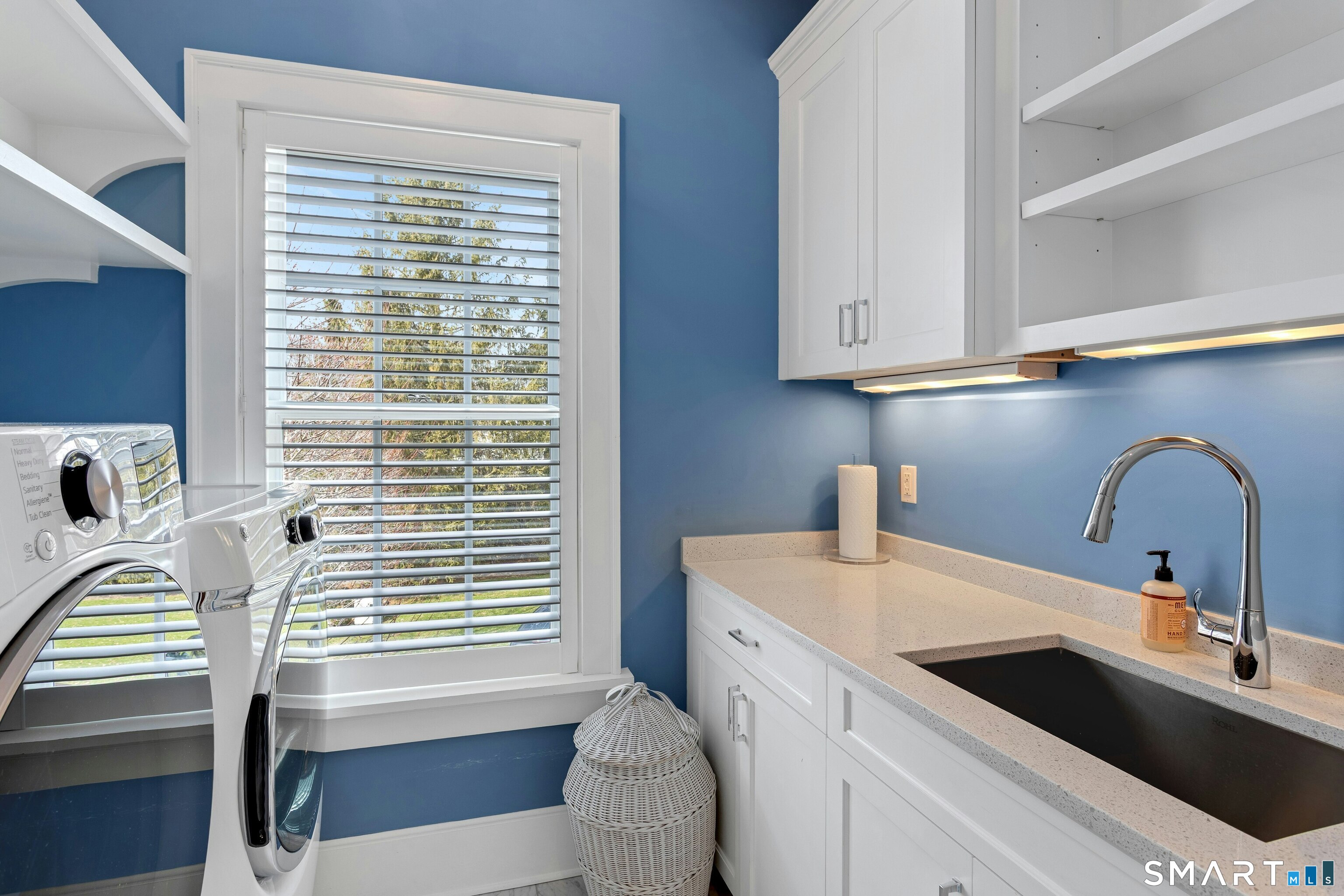 45 Jelliff Mill Road, Unit 45 New Canaan, CT 06840 - Photo 27 of 36 a kitchen with a sink a window and cabinets