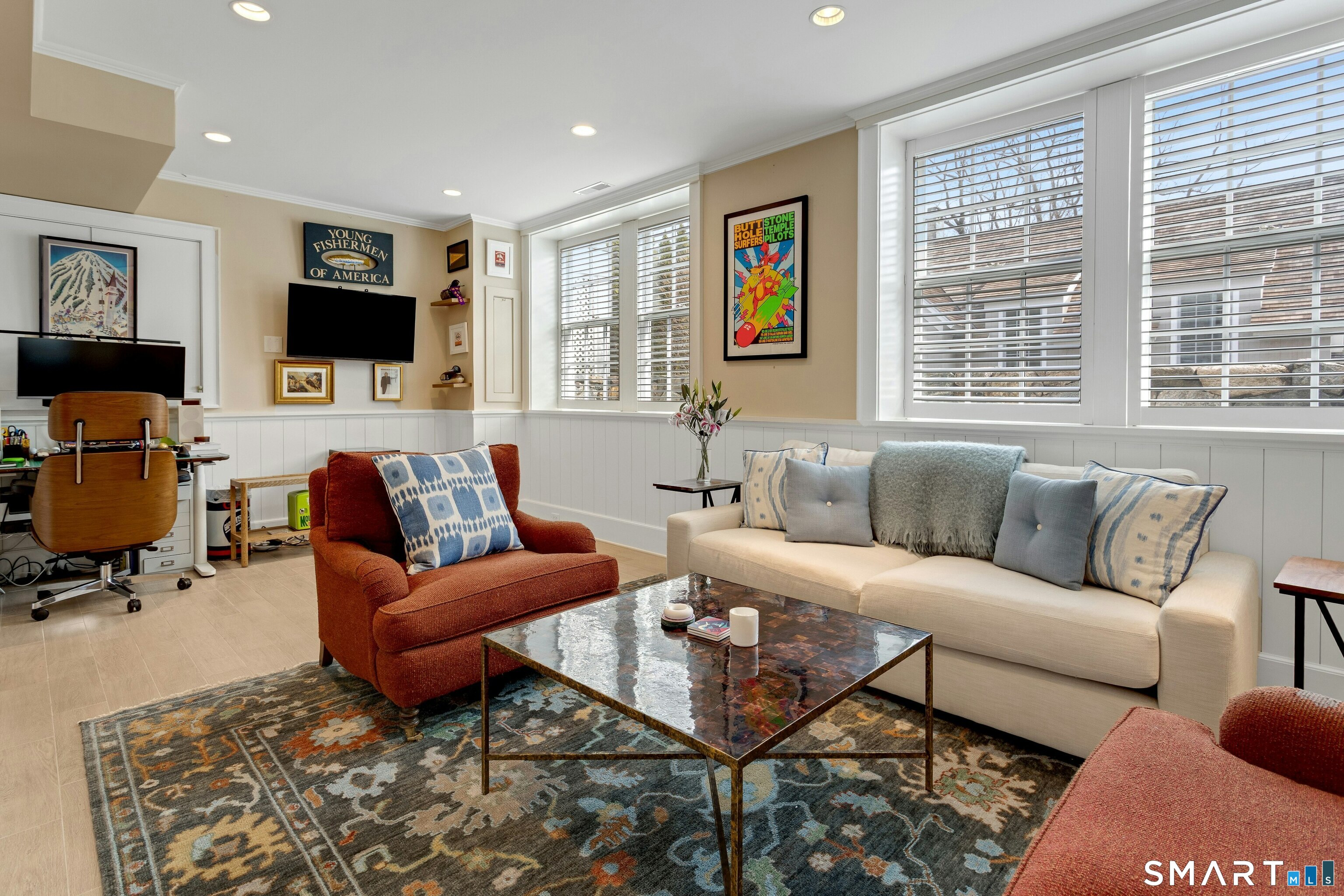 45 Jelliff Mill Road, Unit 45 New Canaan, CT 06840 - Photo 28 of 36 a living room with furniture a flat screen tv and a window