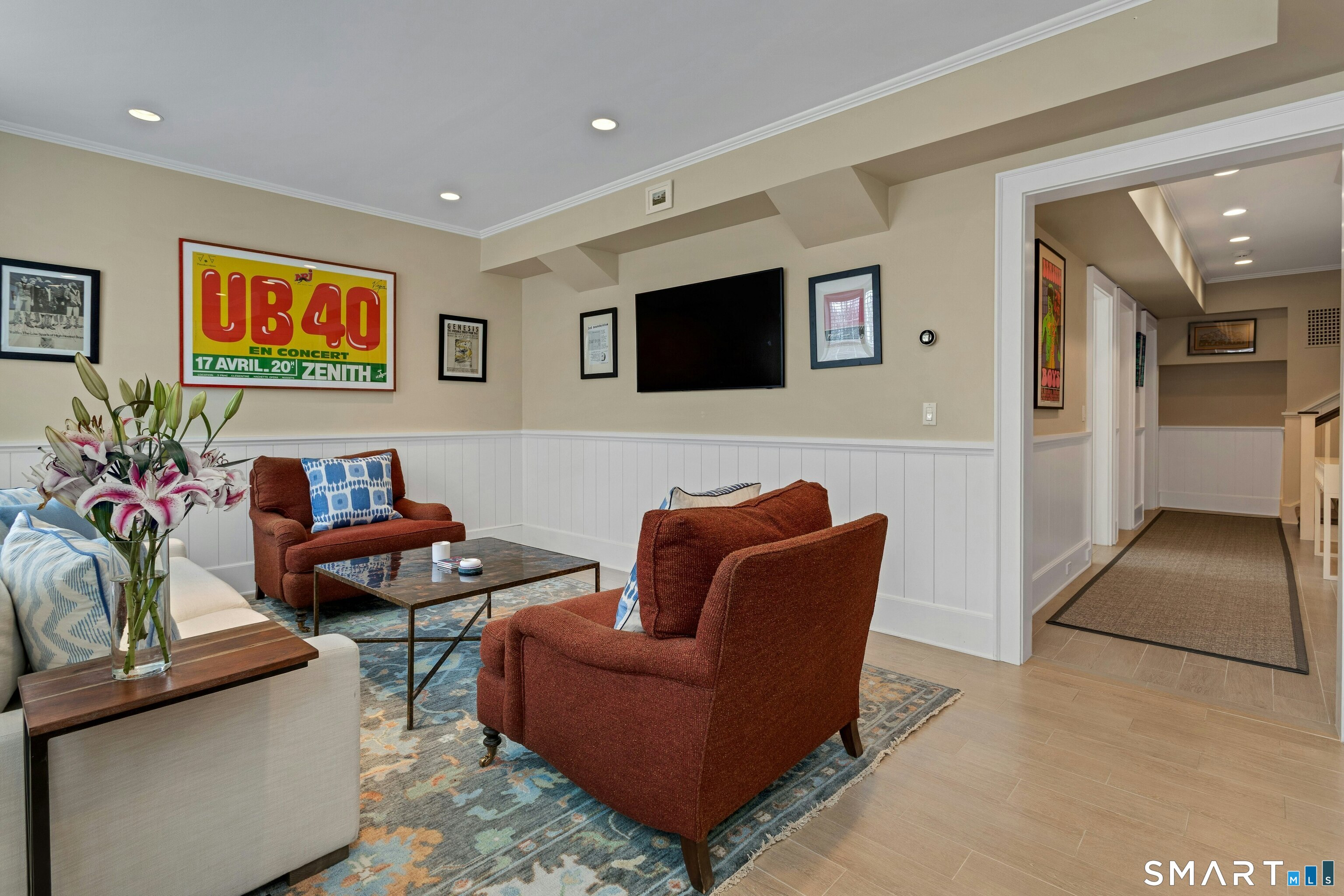 45 Jelliff Mill Road, Unit 45 New Canaan, CT 06840 - Photo 29 of 36 a living room with furniture and a flat screen tv