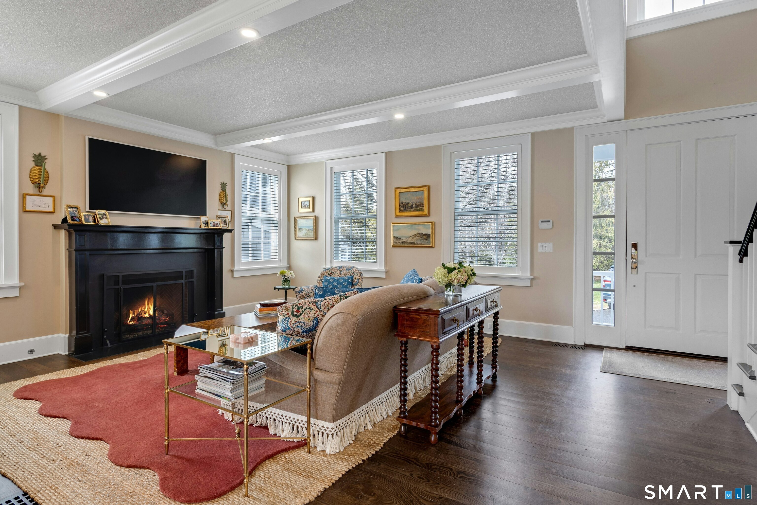 45 Jelliff Mill Road, Unit 45 New Canaan, CT 06840 - Photo 3 of 36 a living room with furniture fireplace and flat screen tv