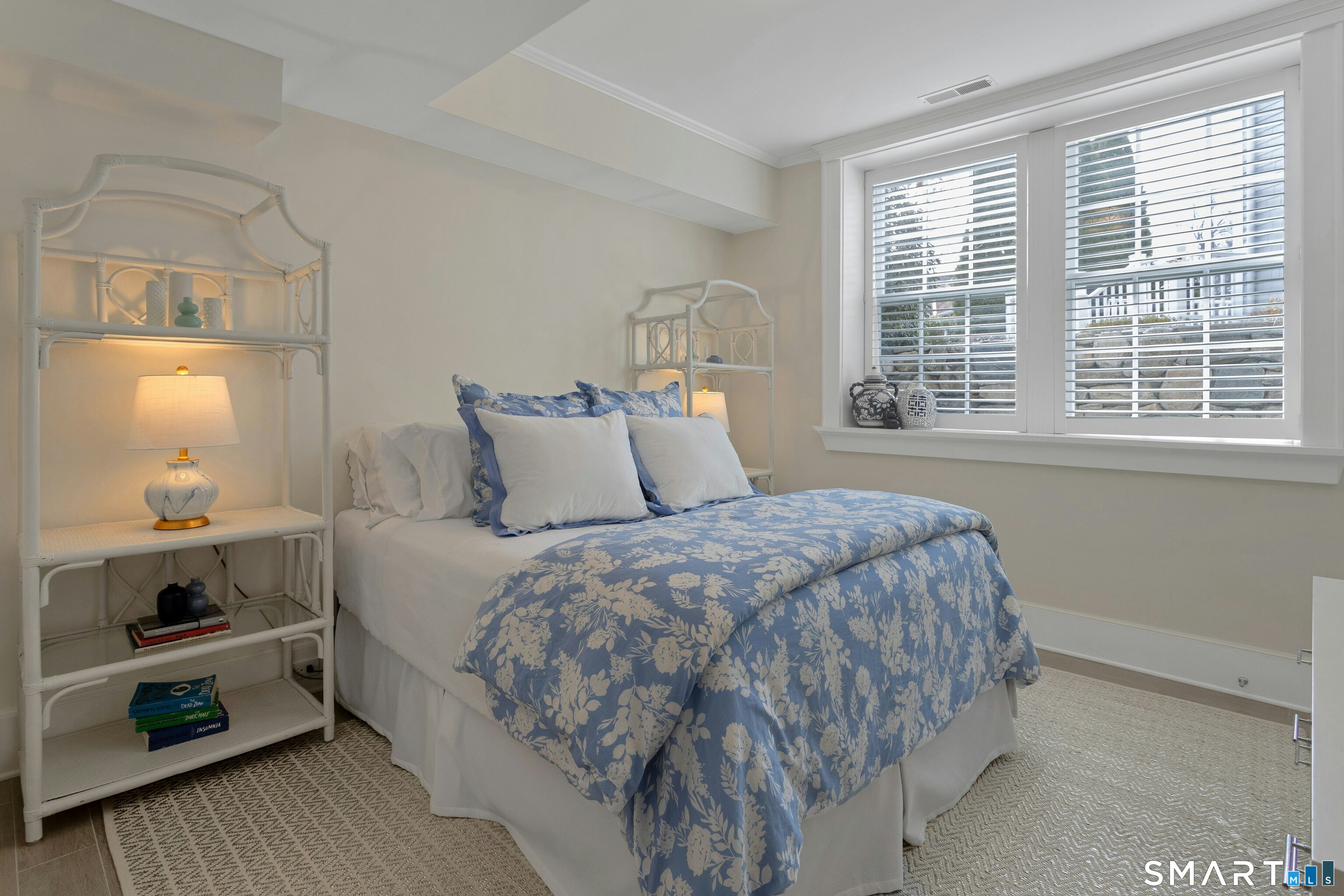 45 Jelliff Mill Road, Unit 45 New Canaan, CT 06840 - Photo 31 of 36 a bedroom with a bed and a window