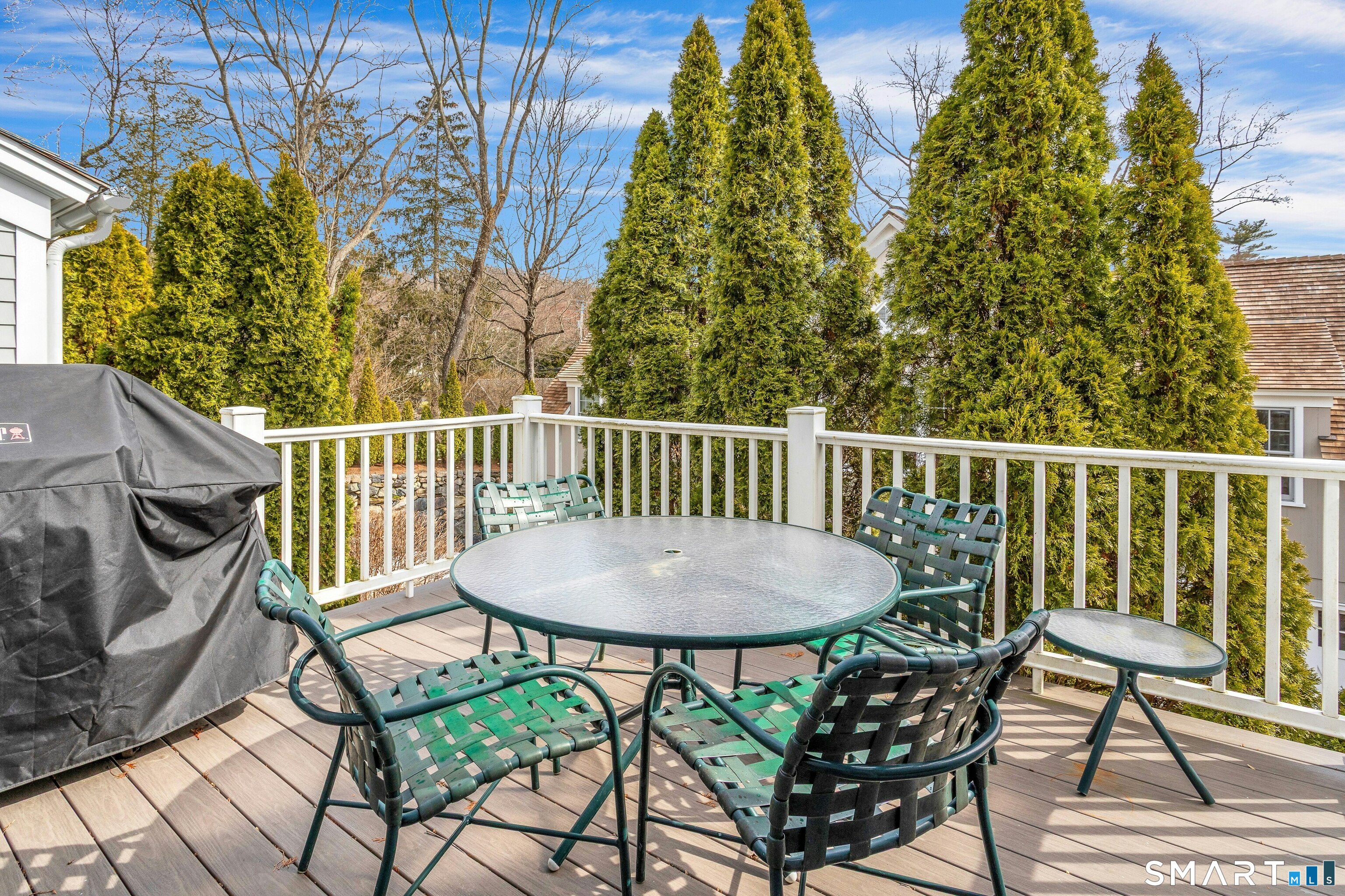 45 Jelliff Mill Road, Unit 45 New Canaan, CT 06840 - Photo 33 of 36 a view of a two chairs and table in the balcony