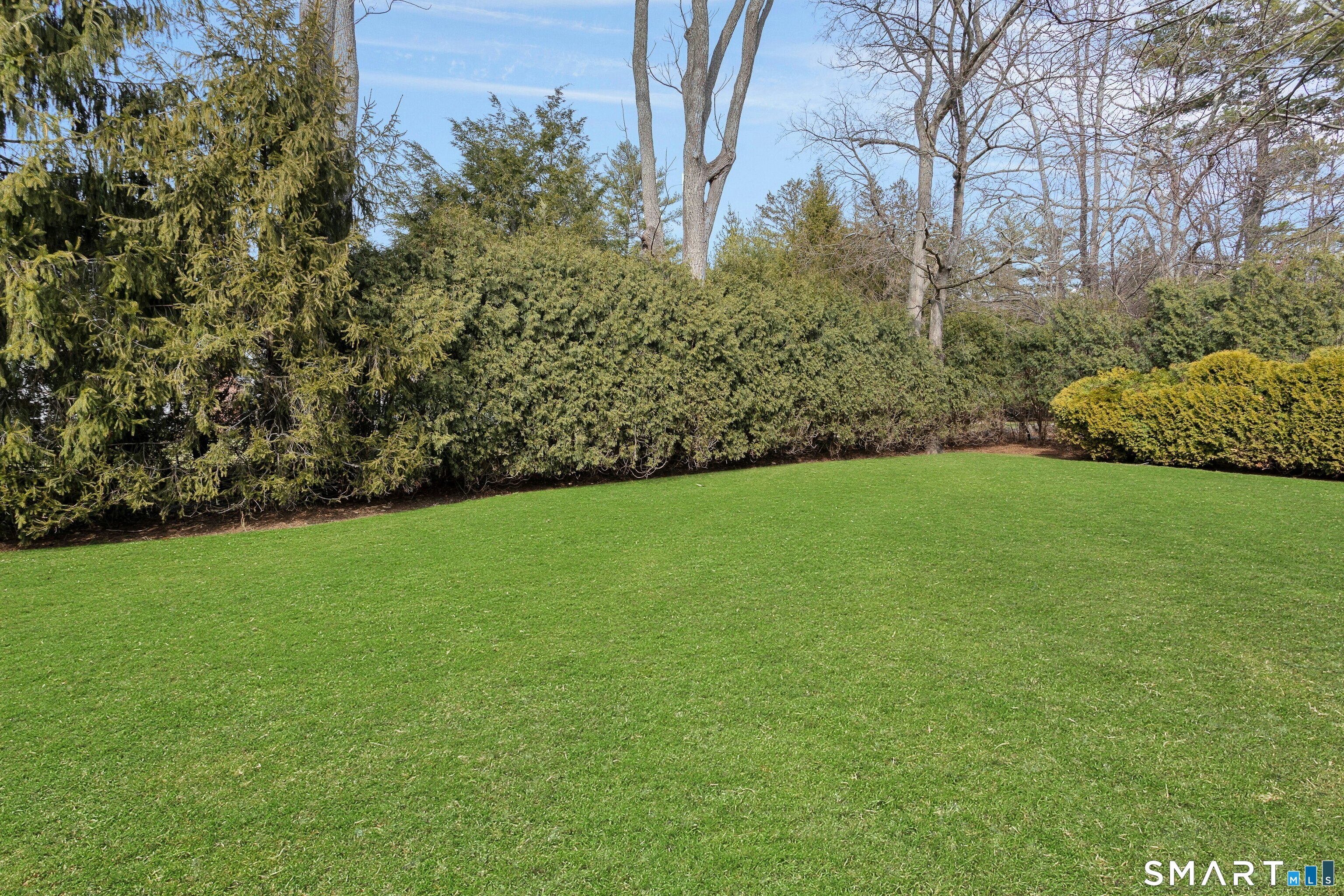 45 Jelliff Mill Road, Unit 45 New Canaan, CT 06840 - Photo 34 of 36 a view of a field of grass and trees