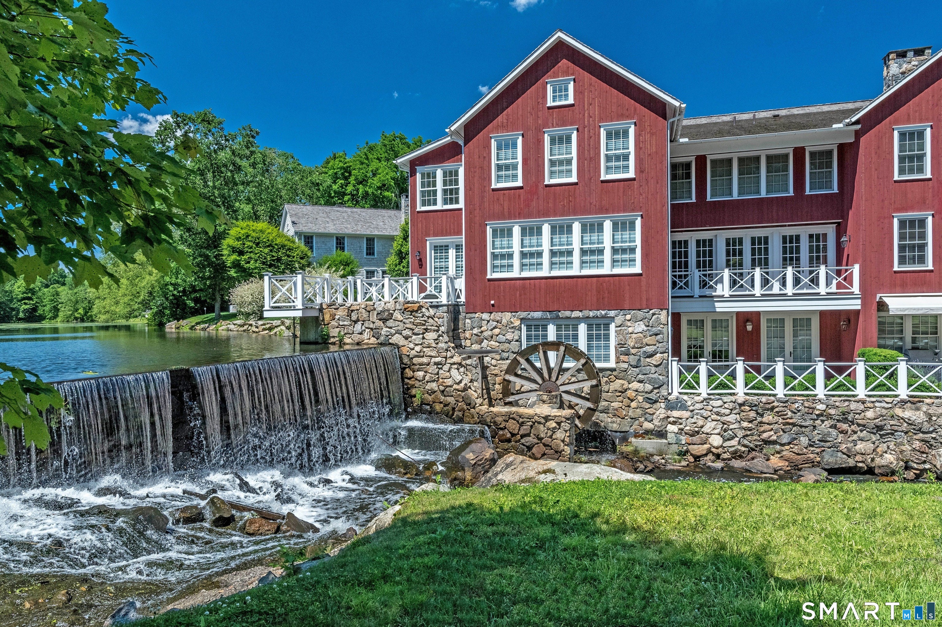 45 Jelliff Mill Road, Unit 45 New Canaan, CT 06840 - Photo 36 of 36 a front view of a house with a yard