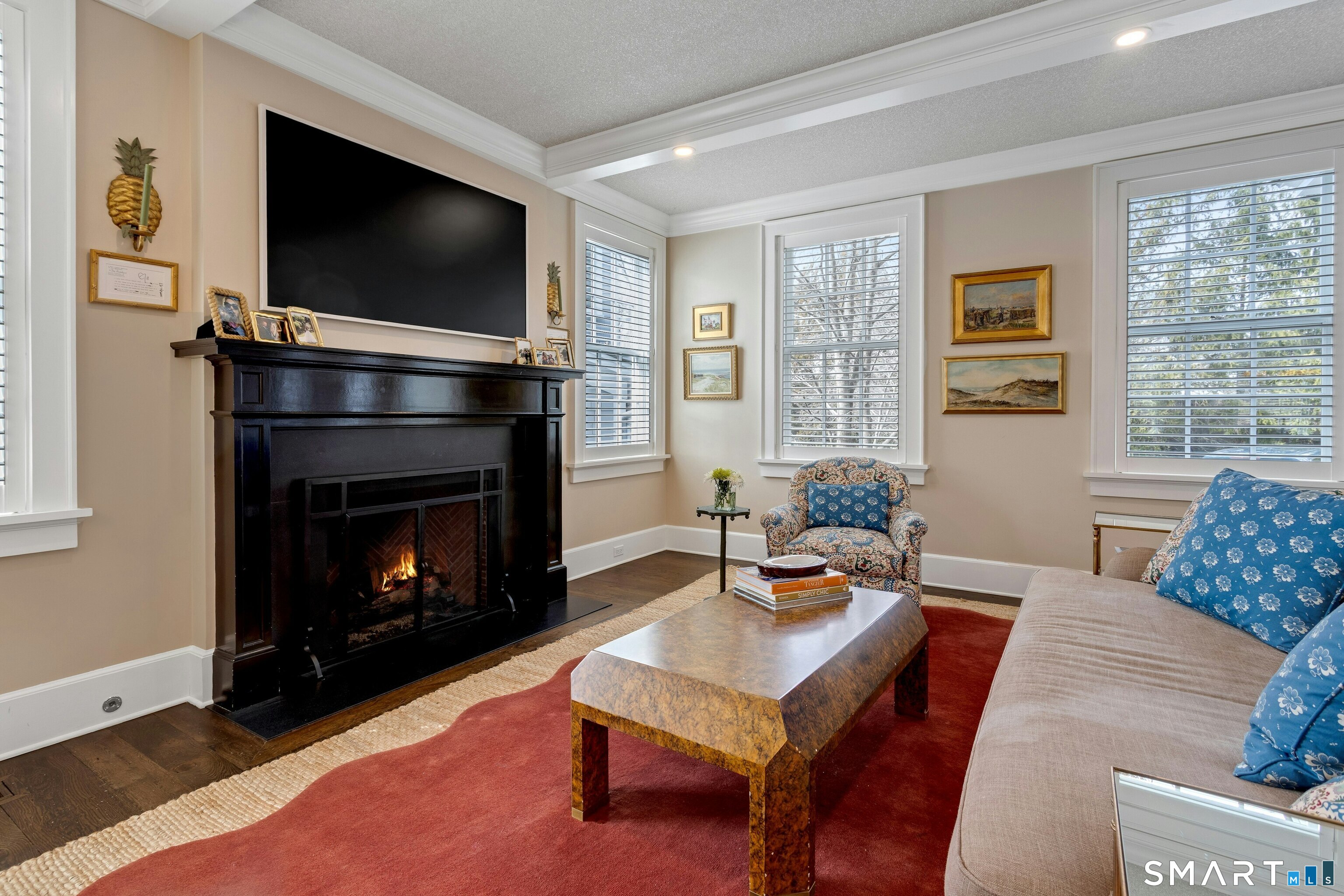 45 Jelliff Mill Road, Unit 45 New Canaan, CT 06840 - Photo 4 of 36 a living room with furniture a flat screen tv and a fireplace