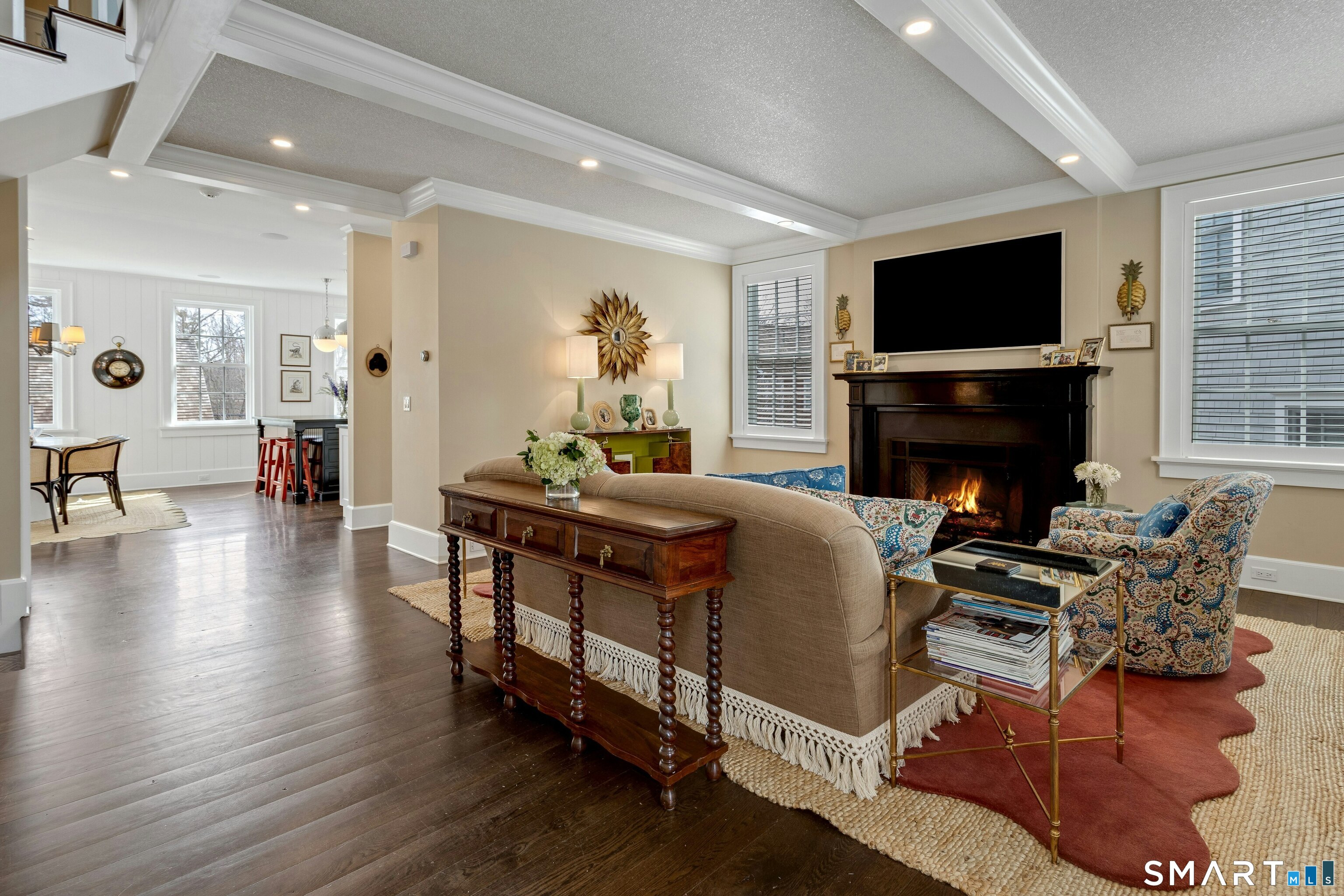 45 Jelliff Mill Road, Unit 45 New Canaan, CT 06840 - Photo 7 of 36 a living room with furniture a flat screen tv and a fireplace