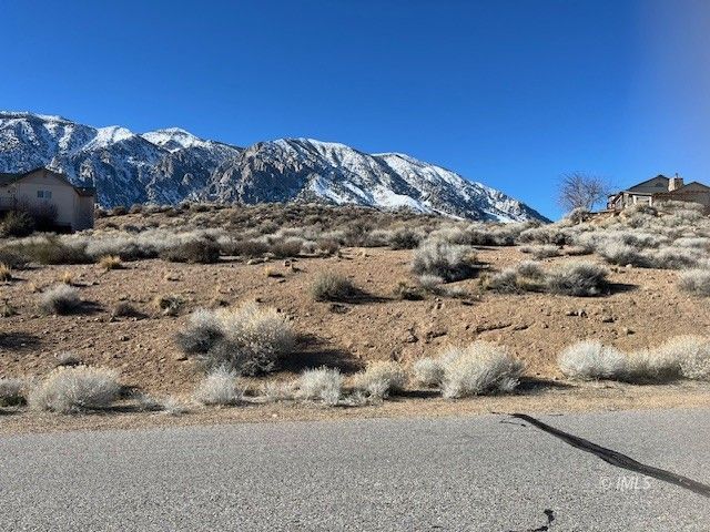 a view of a road with a mountain view in back