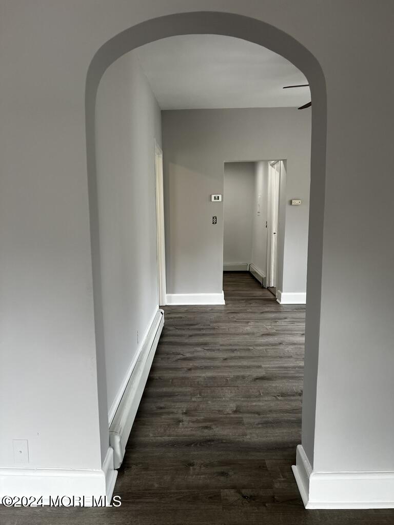 615 2nd Avenue, Unit 1 Asbury Park, NJ 07712 - Photo 13 of 39 a view of a hallway with wooden floor