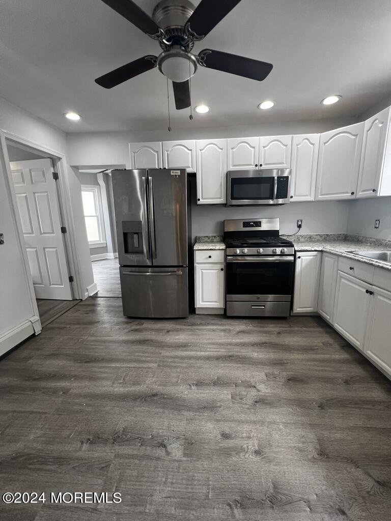 615 2nd Avenue, Unit 1 Asbury Park, NJ 07712 - Photo 23 of 39 a kitchen with stainless steel appliances granite countertop a refrigerator a stove a sink and a microwave