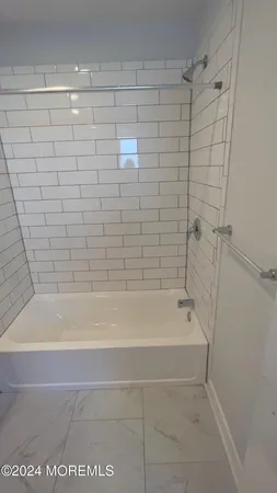 a close up of a bathtub in a bathroom