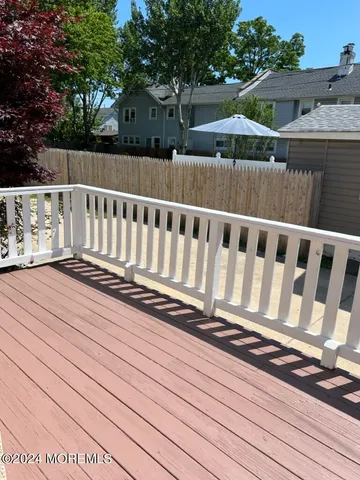 a view of deck and a yard