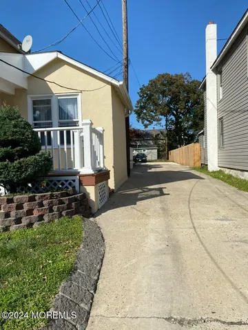 a view of street with parked cars
