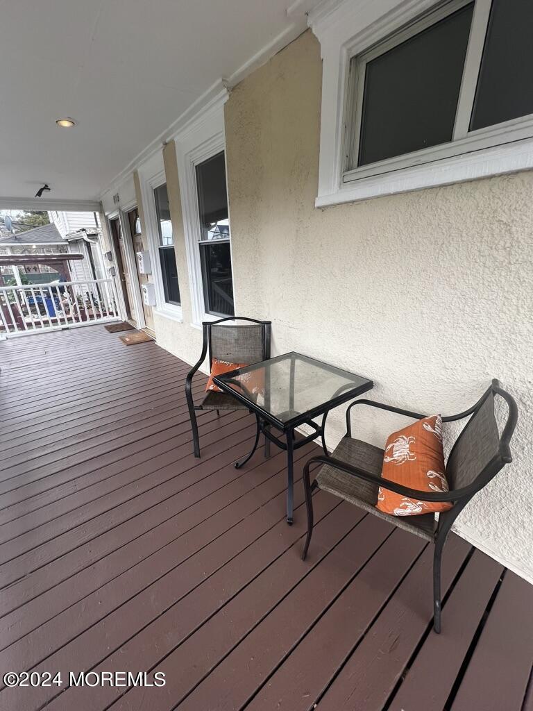 615 2nd Avenue, Unit 1 Asbury Park, NJ 07712 - Photo 4 of 39 a workspace with wooden floor and furniture
