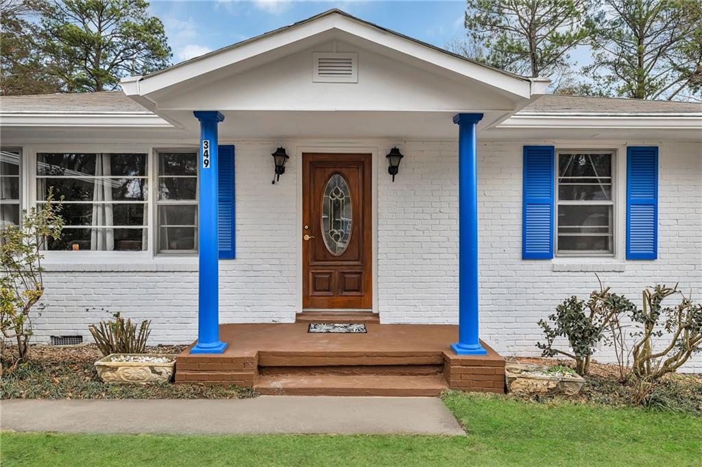 349 Virginia Place Southeast Marietta, GA 30067 - Photo 1 of 37 a front view of a house with garden