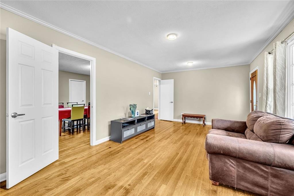 349 Virginia Place Southeast Marietta, GA 30067 - Photo 12 of 37 a living room with furniture and a wooden floor