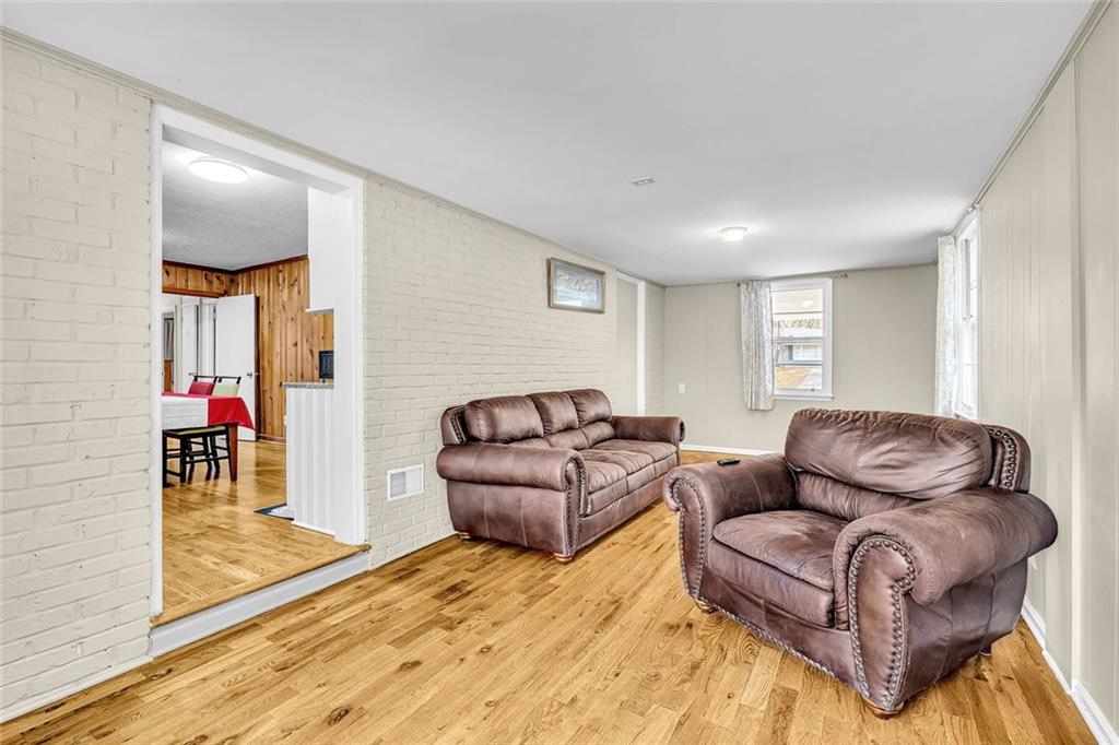 349 Virginia Place Southeast Marietta, GA 30067 - Photo 18 of 37 a living room with furniture window and a wooden floor
