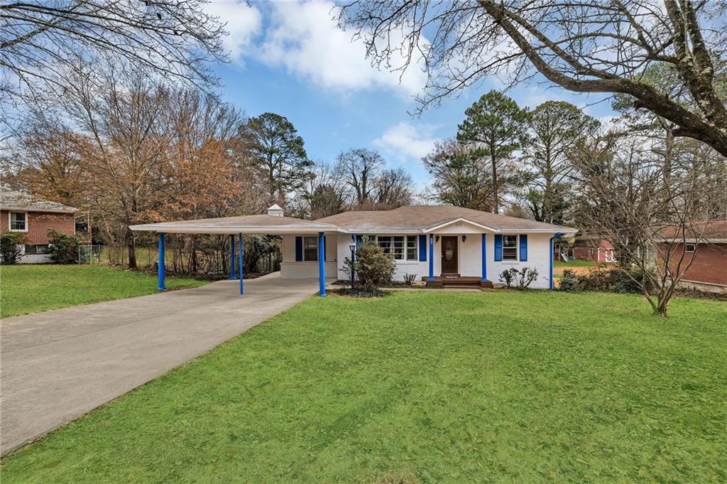 349 Virginia Place Southeast Marietta, GA 30067 - Photo 2 of 37 a view of a house with a yard