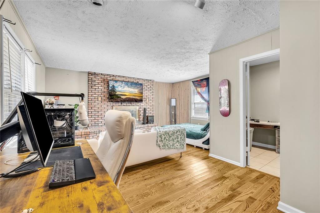 349 Virginia Place Southeast Marietta, GA 30067 - Photo 21 of 37 a living room with furniture a flat screen tv and a refrigerator