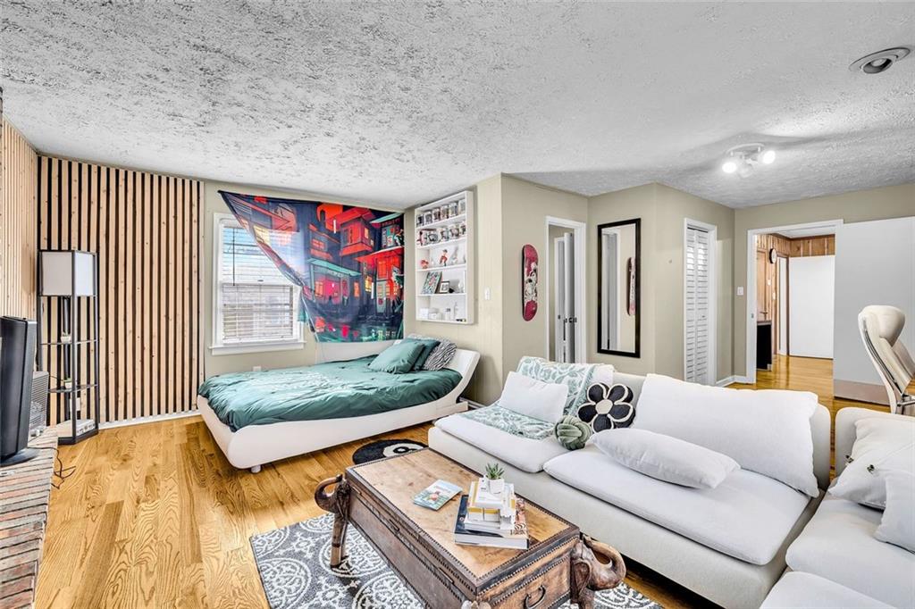 349 Virginia Place Southeast Marietta, GA 30067 - Photo 22 of 37 a living room with furniture and a wooden floor