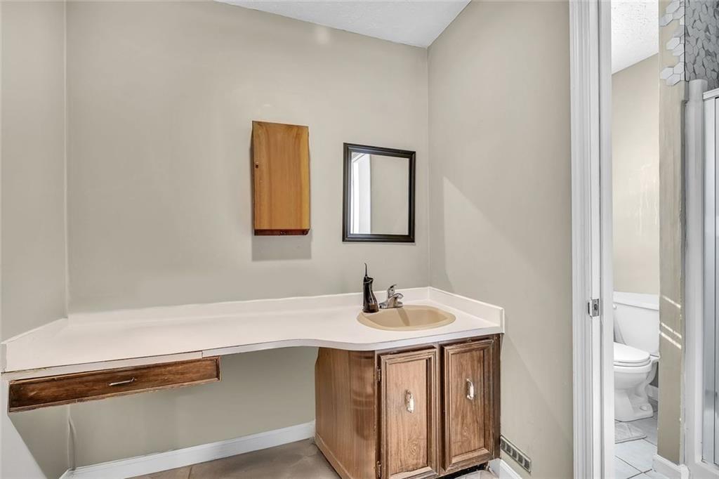 349 Virginia Place Southeast Marietta, GA 30067 - Photo 23 of 37 a bathroom with a sink and a toilet