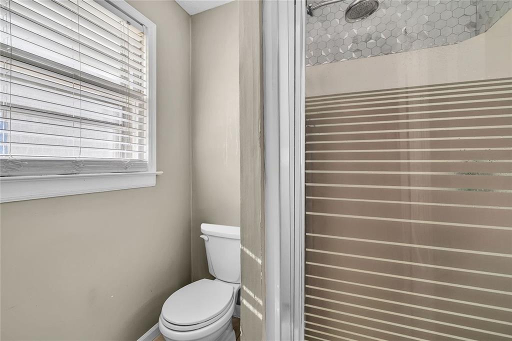 349 Virginia Place Southeast Marietta, GA 30067 - Photo 24 of 37 a white toilet sitting next to a window