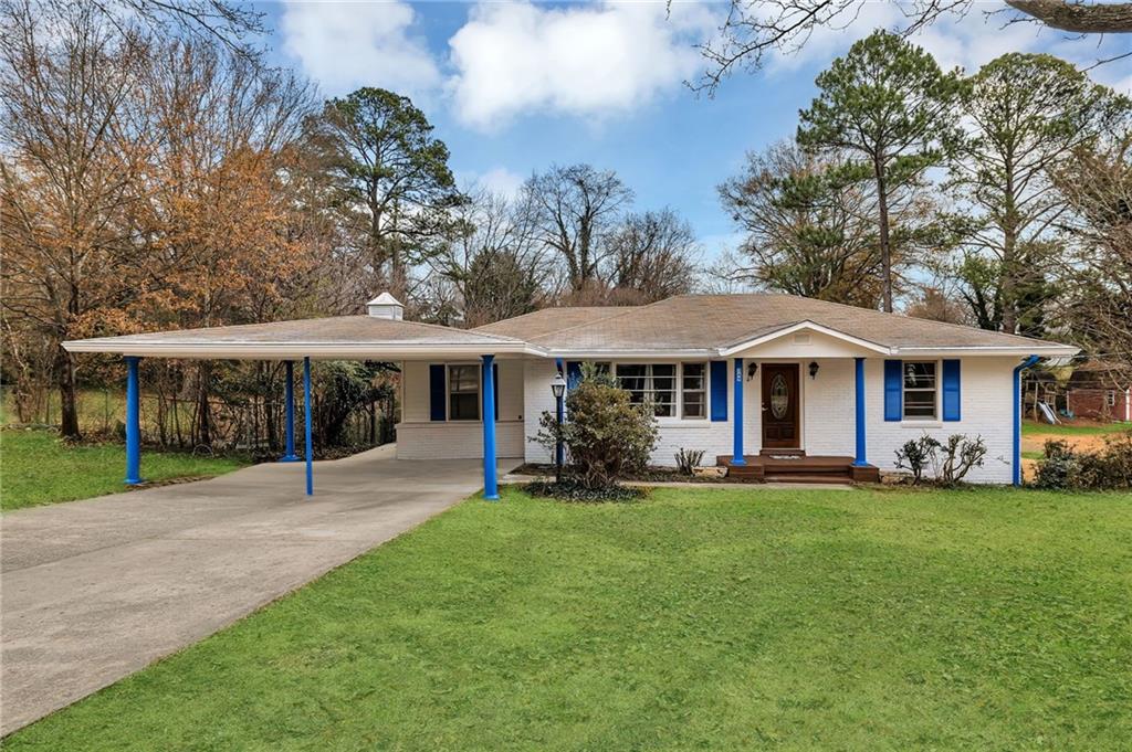 349 Virginia Place Southeast Marietta, GA 30067 - Photo 3 of 37 a front view of a house with a garden