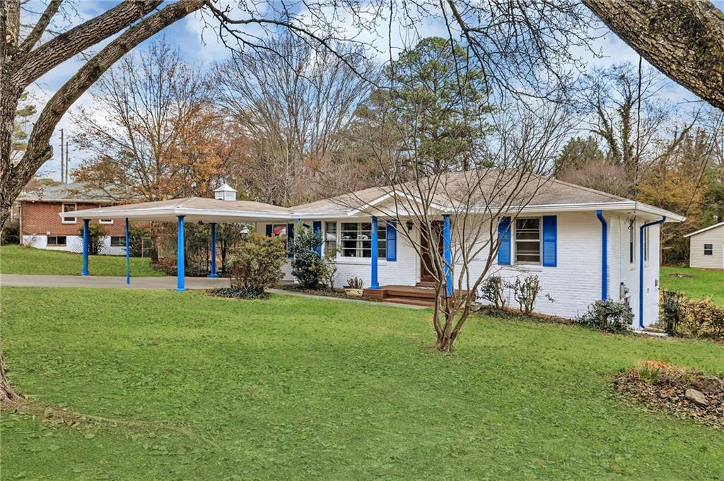349 Virginia Place Southeast Marietta, GA 30067 - Photo 5 of 37 front view of a house with a yard