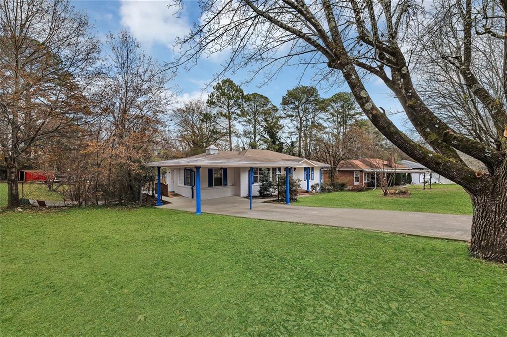 349 Virginia Place Southeast Marietta, GA 30067 - Photo 6 of 37 a view of a house with a big yard