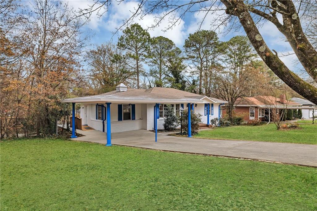 349 Virginia Place Southeast Marietta, GA 30067 - Photo 7 of 37 a view of a house with a yard porch and sitting area