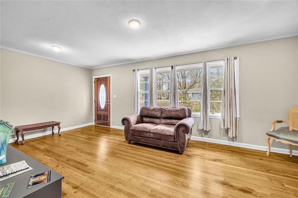 349 Virginia Place Southeast Marietta, GA 30067 - Photo 10 of 37 a living room with furniture and a floor to ceiling window