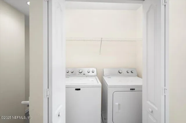 a utility room with dryer and washer
