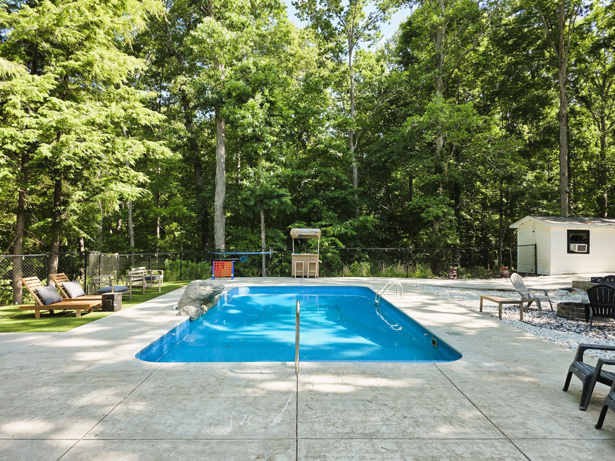 1975 Kelly Road Holladay, TN 38341 - Photo 13 of 95 a view of a swimming pool with a lounge chair