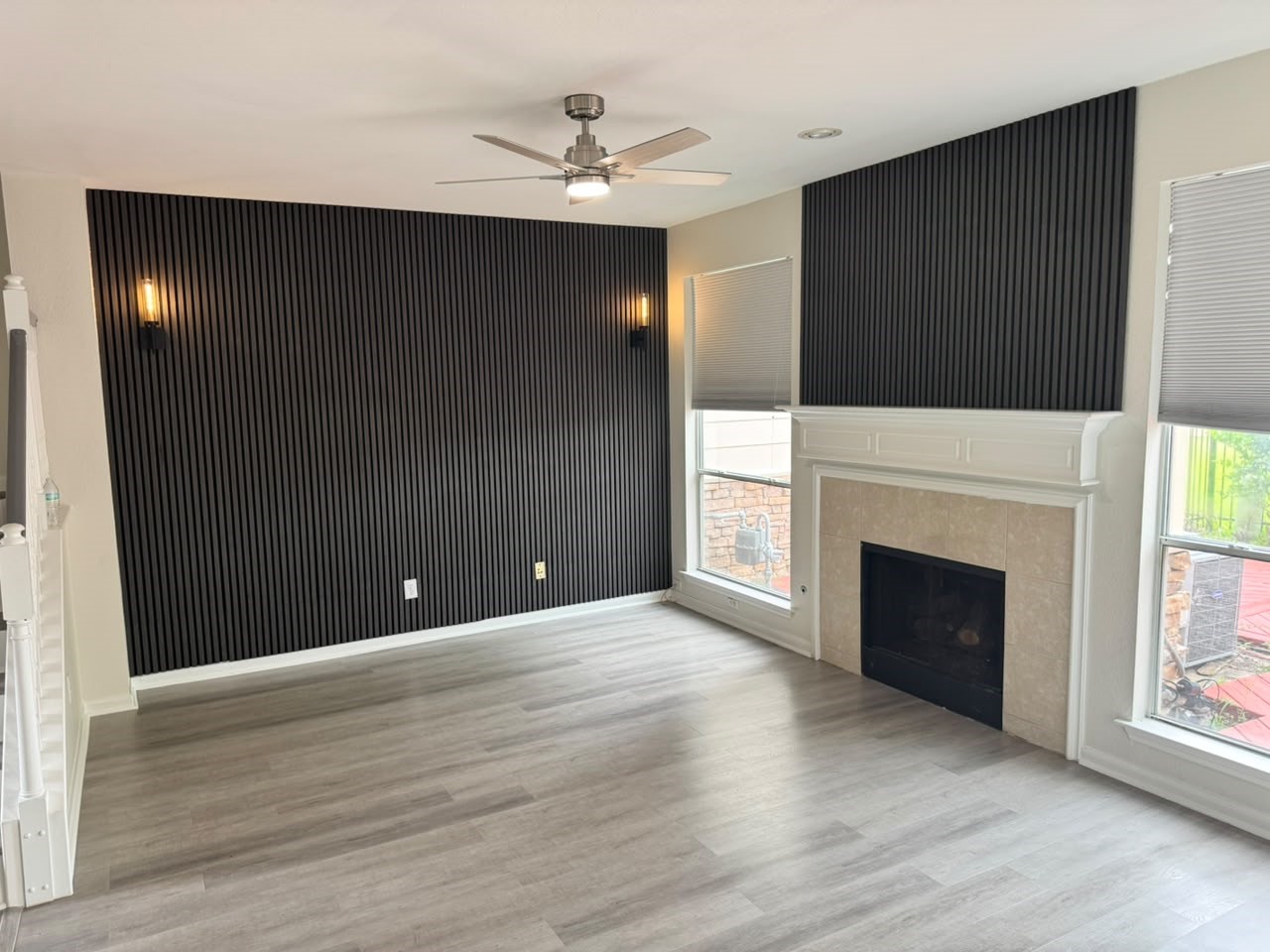 2110 Ridge Wood Lane Sugar Land, TX 77479 - Photo 8 of 23 a view of an empty room with wooden floor and a fireplace