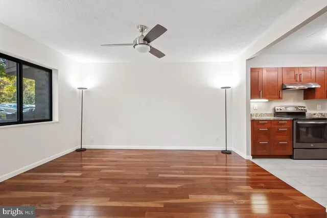 a kitchen with stainless steel appliances granite countertop a refrigerator stove a sink and dishwasher