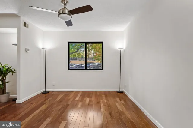 a kitchen with stainless steel appliances granite countertop a refrigerator a stove and a sink with granite countertops