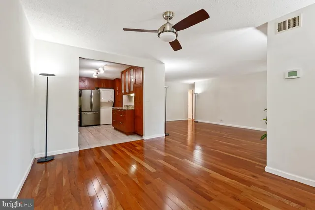 a view of a hallway with a wooden door