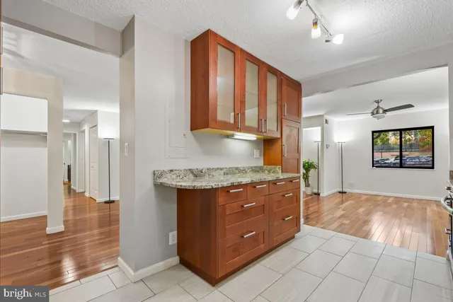 a view of a kitchen with wooden floor