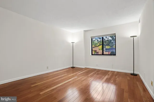 a bathroom with a sink vanity mirror and toilet