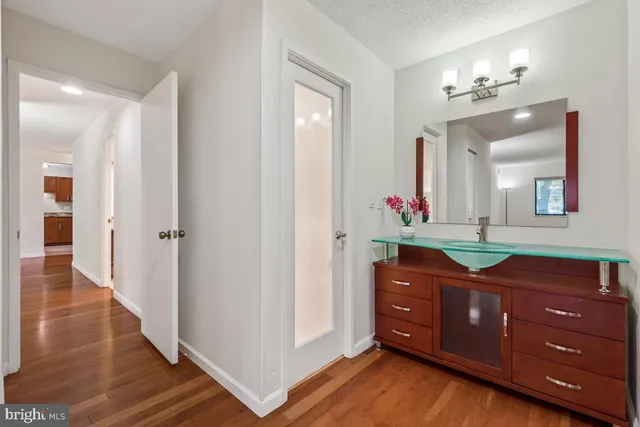 a bathroom with a sink and mirror
