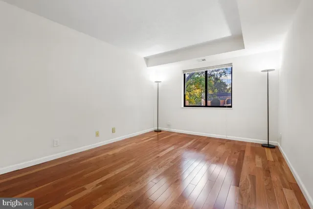 a view of a cars park in front of a house
