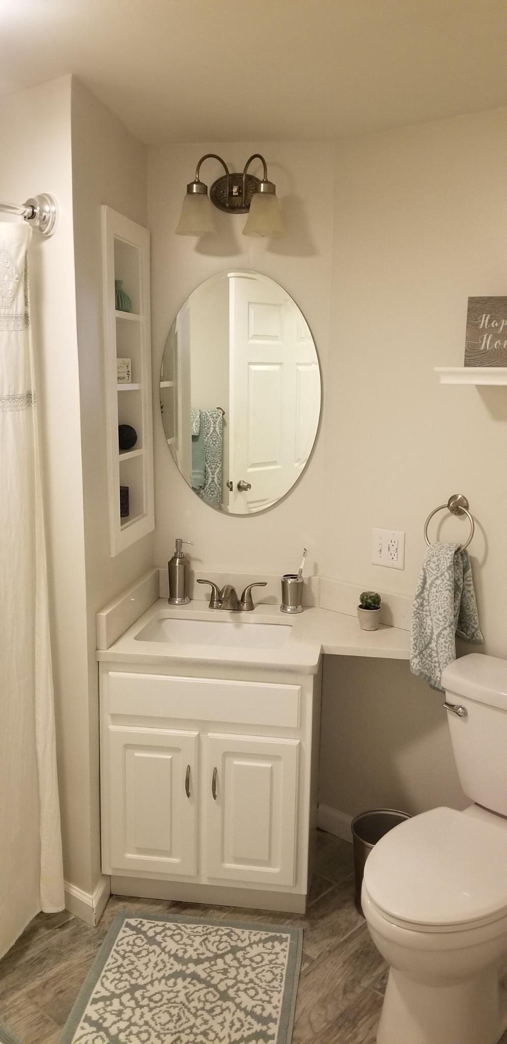 51 Brook Street, Unit 5A Naugatuck, CT 06770 - Photo 12 of 15 a bathroom with a granite countertop toilet sink and mirror
