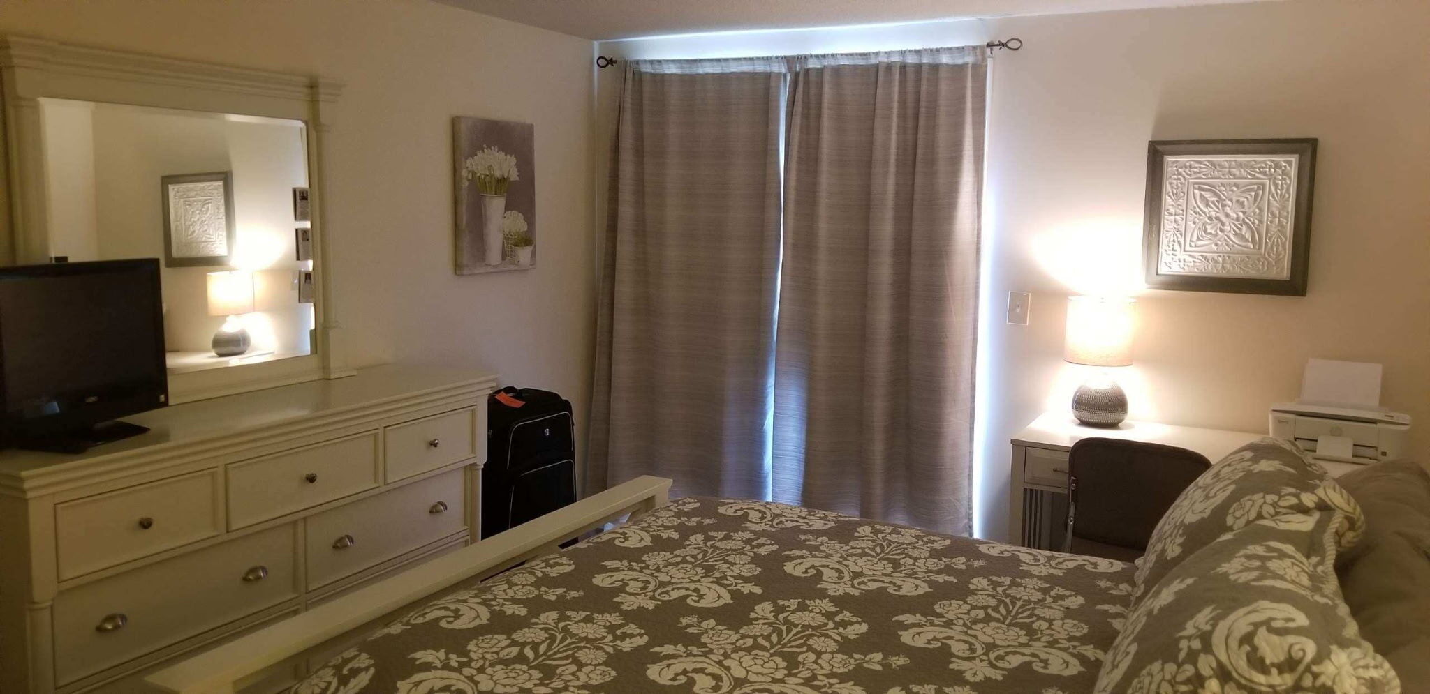 51 Brook Street, Unit 5A Naugatuck, CT 06770 - Photo 14 of 15 a bedroom with a bed and a flat tv screen on a dresser