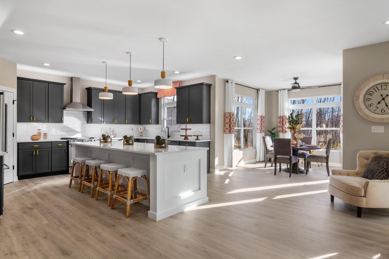8772 Potomac Way Lowell, IN 46356 - Photo 5 of 22 a kitchen with stainless steel appliances kitchen island granite countertop a stove a sink a refrigerator and a fireplace