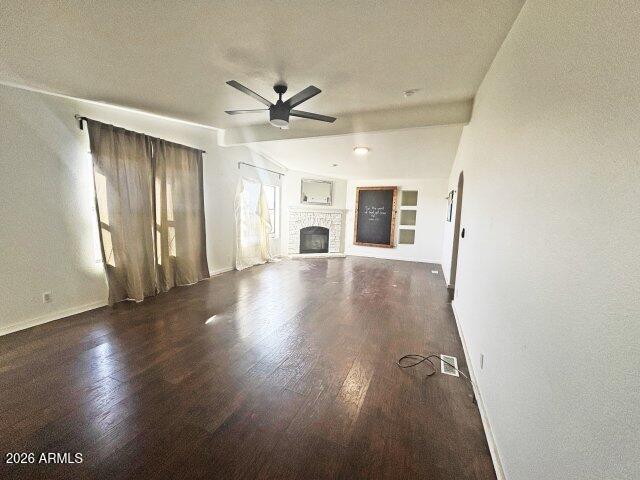 1595 Bourdon Ranch Road Show Low, AZ 85901 - Photo 21 of 41 a view of a livingroom with wooden floor and a ceiling fan