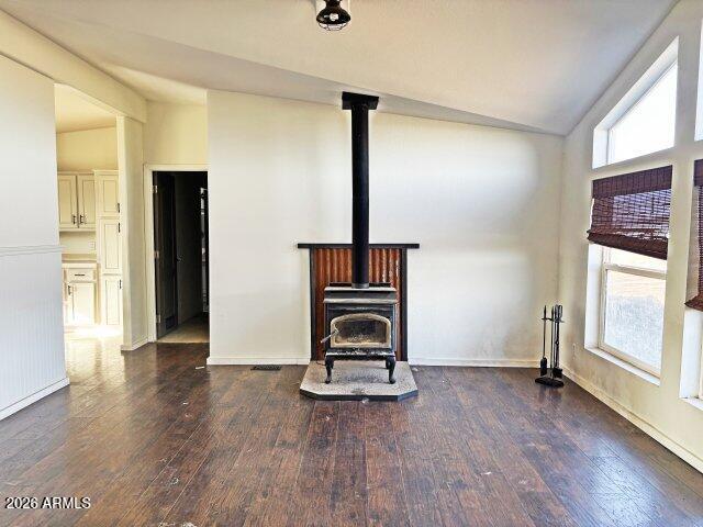 1595 Bourdon Ranch Road Show Low, AZ 85901 - Photo 22 of 41 a view of an empty room with wooden floor and windows