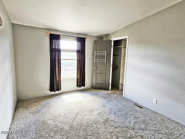 1595 Bourdon Ranch Road Show Low, AZ 85901 - Photo 26 of 41 an empty room with closet and a window