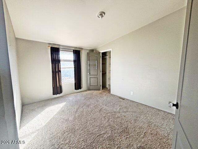 1595 Bourdon Ranch Road Show Low, AZ 85901 - Photo 31 of 41 an empty room with a natural light