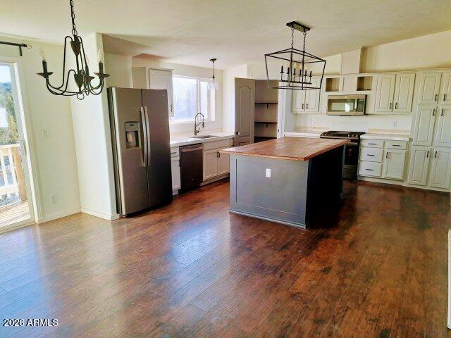 1595 Bourdon Ranch Road Show Low, AZ 85901 - Photo 4 of 41 a kitchen with stainless steel appliances a refrigerator and wooden floor