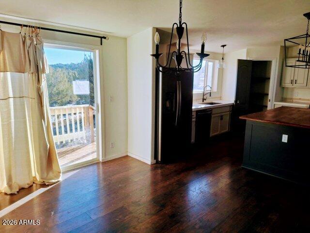 1595 Bourdon Ranch Road Show Low, AZ 85901 - Photo 10 of 41 a kitchen with a refrigerator and wooden floor